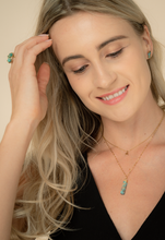 Load image into Gallery viewer, 14k gold plated stainless steel and natural turquoise pendant on a 14k dainty gold plated stainless steel chain on a model