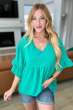 Load image into Gallery viewer, Airflow Peplum Ruffle Sleeve Top in Emerald